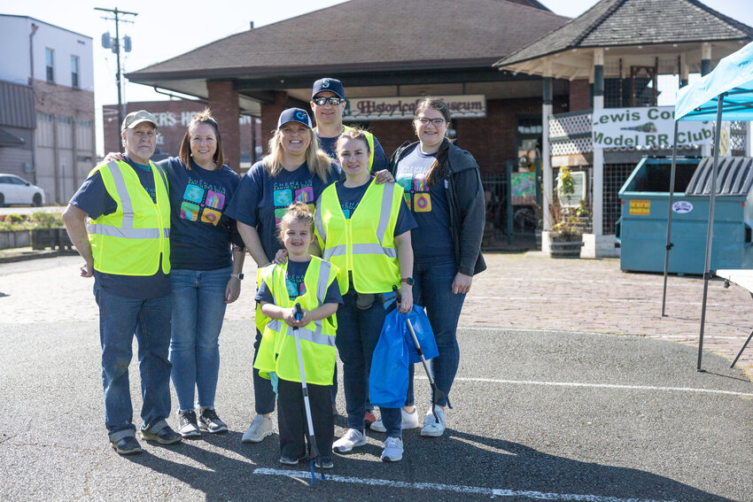 Volunteers and board members of Experience Chehalis pose for a photo during the Earth Day community clean-up in Chehalis on Saturday, April 20.