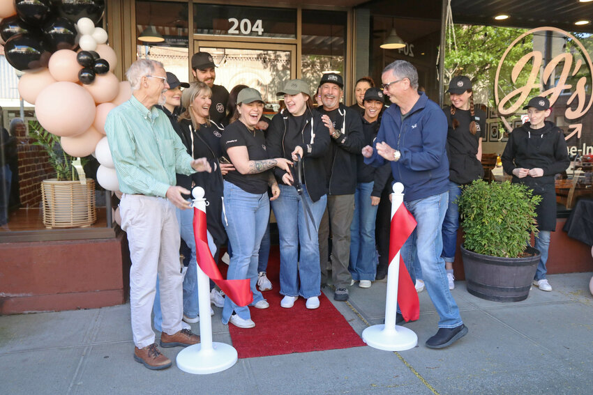 JJ's ToGo owners Jessica and Devin Britton, JJ's staff and Centralia-Chehalis Chamber of Commerce members cut the ribbon to formally open the restaurant's brick-and-mortar location in Centralia on Monday, April 22.