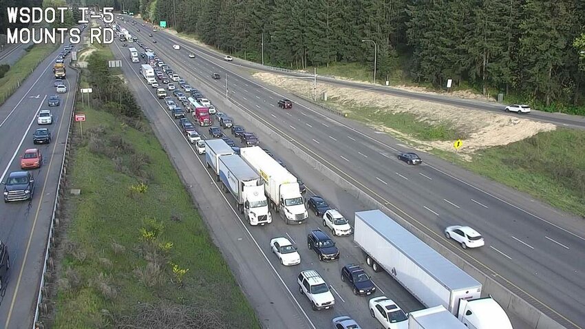 Traffic was backed up on southbound I-5 Monday evening following a wreck between a motorcycle and car, according to Washington State Patrol.