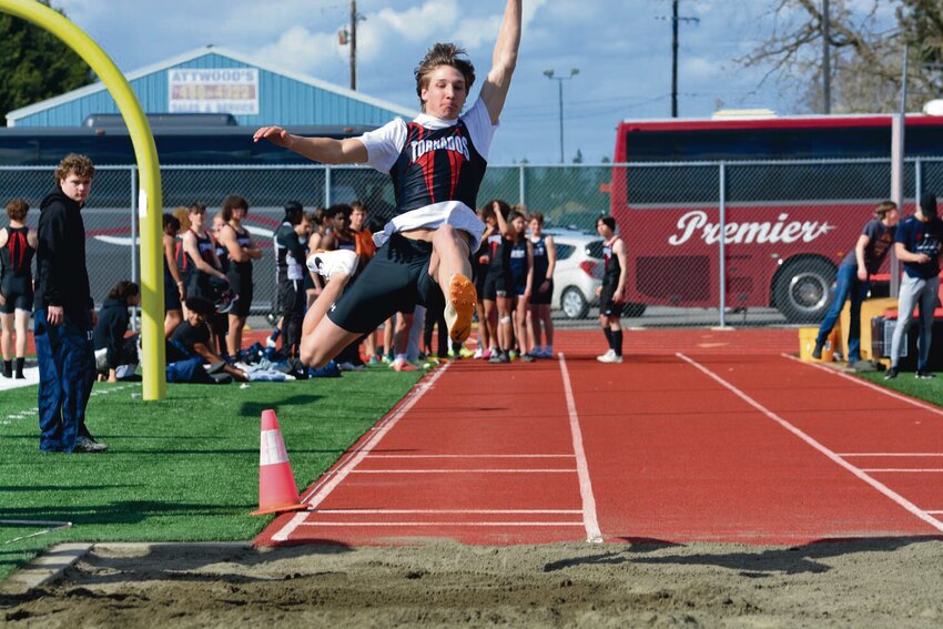 Jordan Lasher competes in the long jump event at a home track meet in 2023.