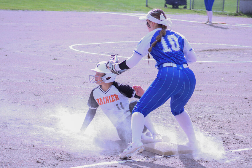 Olivia Earsley slides safely into third base after Brooklynn Swenson's single in the first inning against Elma on April 16.