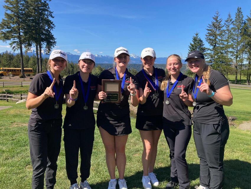 The W.F. West girls golf team smiles and poses for a photo after winning the Sibley Golf Tournament in Shelton on April 22.