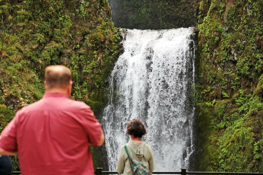 People visit Multnomah Falls in the Columbia River Gorge on Tuesday, April 23, 2024.