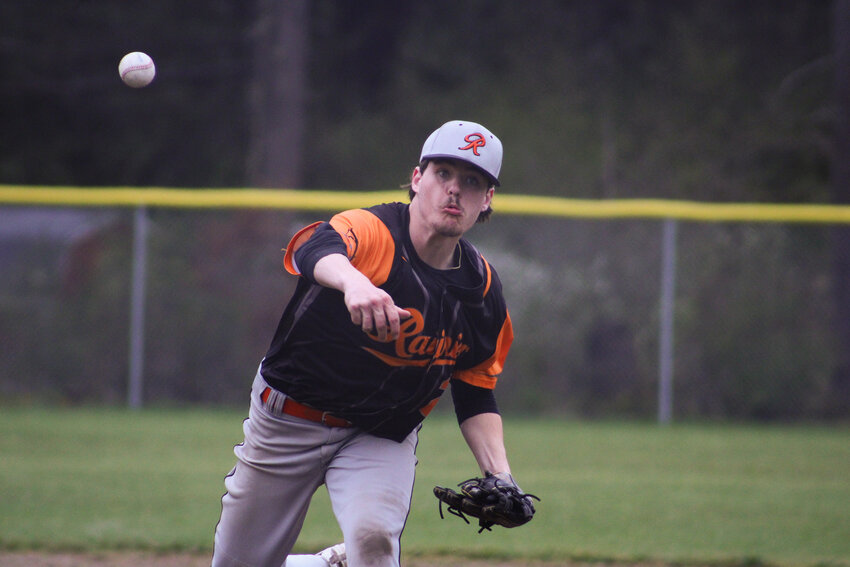 Hunter Howell races back to first base against Napavine on April 27.