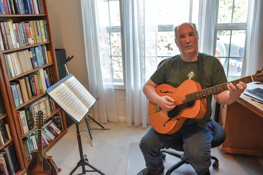 Bob Puckette, a veteran of the mandolin, has picked up the mandocello in recent years. The instrument has a similar set of strings and notes as the cello, but is plucked and held similar to a guitar.