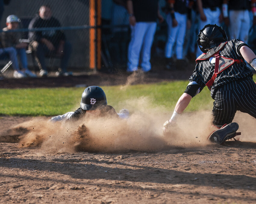Battle Ground&rsquo;s Elliot Jolma scores during the Tigers&rsquo; 8-5 win over the Union Titans at home on Monday, April 22. The Tigers won the series, but their loss Friday, April 26, landed them second in the 4A Greater St. Helens League.