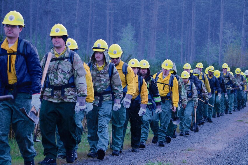 Washington National Guardsmen march to their next station during a wildfire training at Joint Base Lewis-McChord on April 28.