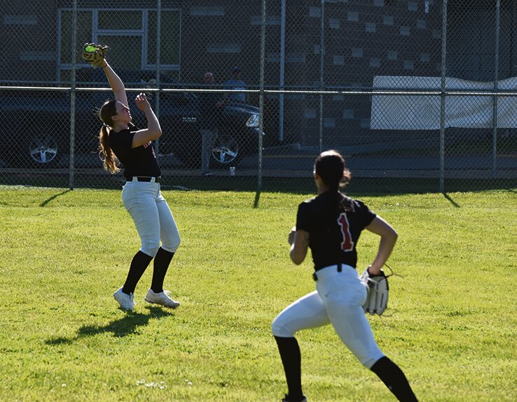 Left fielder Kylie Minker fields a flyout against Timberline on Tuesday, April 23, while playing the Blazers.
