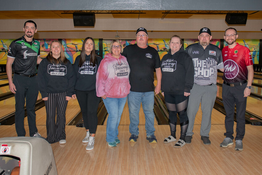 Professional Bowling Association bowlers Marshall Kent, far left, and Edward &ldquo;EJ&rdquo; Tackett, far right, smile for a photo with the Fairway Lanes staff ahead of a local bowling clinic on Tuesday, April 30.