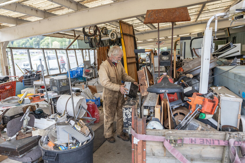 Blake McDrummond, owner of BnT&rsquo;s American Treasures, looks through items to keep at Yard Birds in Chehalis on Tuesday, April 30. The stolen trailer is in the bottom right corner of the photo.