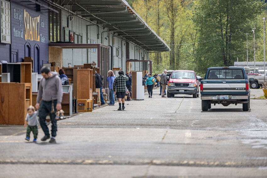 People browse for free items to take from outside of Yard Birds in Chehalis on Tuesday, April 30.