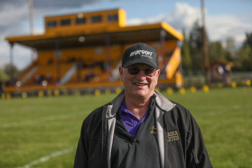 Onalaska Athletic Director Dennis Bower poses for a photo on the Onalaska football field during a track meet on May 2.