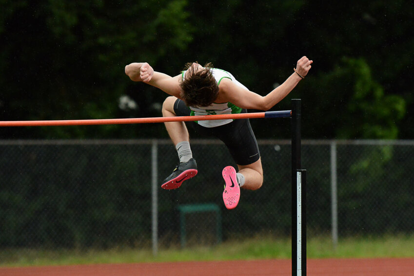 Tumwater's Aaron Paul leaps over the high jump bar at the Shaner Invitational in Tumwater on May 3.