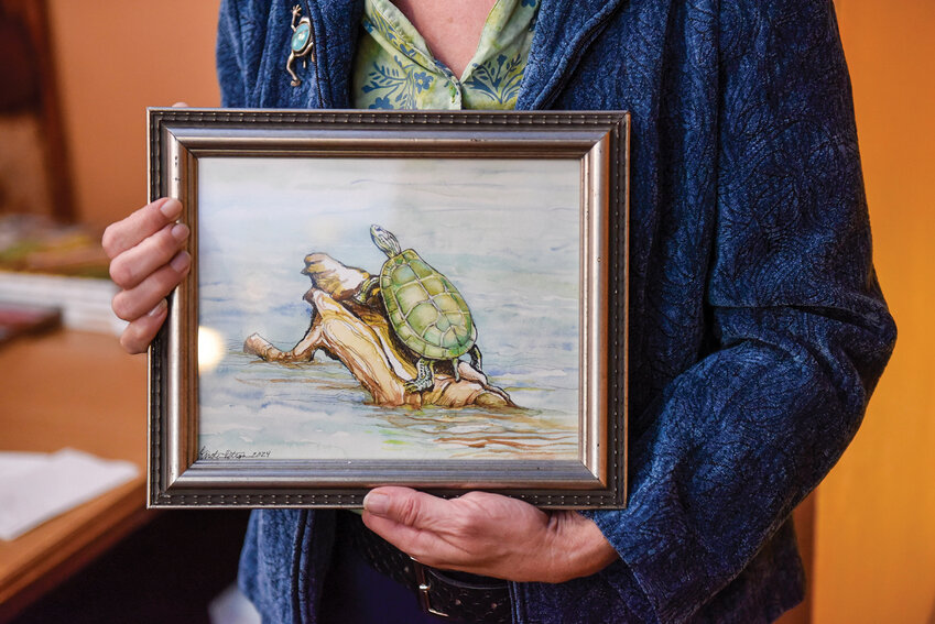 Kirsten Peterson’s interests range from photography to painting. This year, Peterson photographed and painted a turtle on East Fork Lewis River. The La Center Arts Council hosts workshops for arts, including photography and painting.