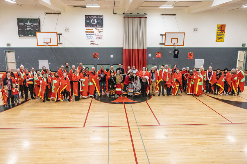 Speakers and participants pose for a photo during the missing or murdered Indigenous persons (MMIP) solidarity event at Toledo Middle School on Sunday, May 5. The Toledo Police Department unveiled a custom patch to recognize missing and murdered Indigenous people (MMIP) across the country, with officials hoping the first-in-the-country patch will inspire other departments to take a similar step. The event coincided with MMIP National Awareness Day, held annually on May 5, and included testimonials and tributes to the disproportionate rate that Indigenous tribes face abuse, and the challenges families often face when seeking justice. A descendent of the Colville Tribe and Fort Peck Assiniboine, Toledo Police Chief Duane Garvais Lawrence praised former Mayor Steve Dobosh, current Mayor Cheri Devore and former city council member Kelly Thomas for their work in securing the patch. The Chronicle will have additional coverage of the ceremony in the Thursday&rsquo;s edition.