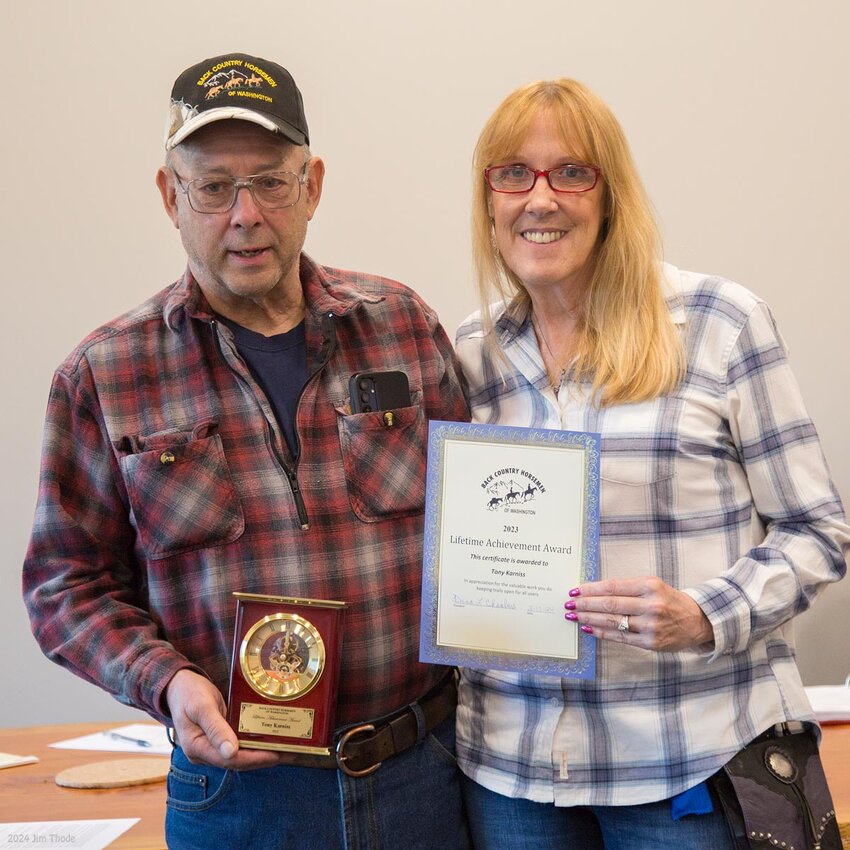 Tony Karniss is presented a Lifetime Achievement Award by Back Country Horsemen of Washington President Dana Chamber on May 2 in Onalaska.