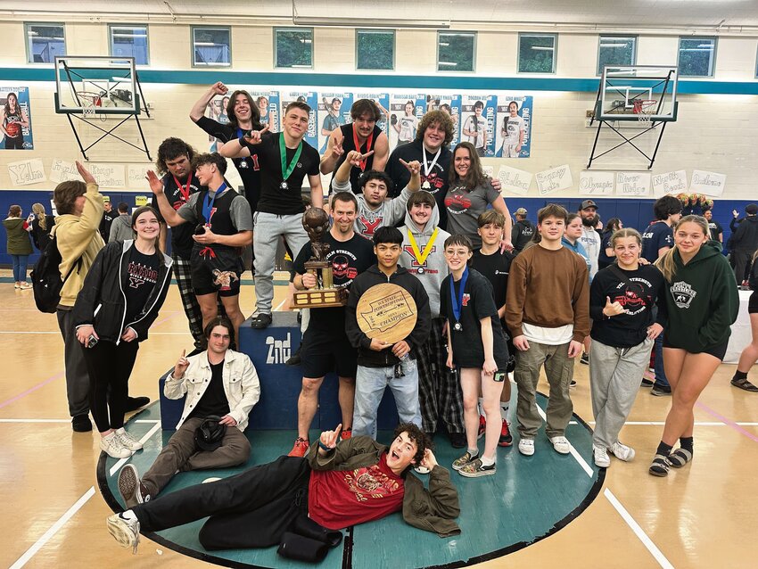 Yelm's powerlifting team poses with the trophy after winning the Washington powerlifting state championship.