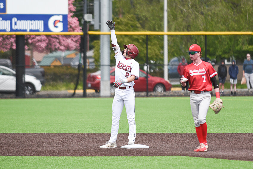 W.F. West's Braden Jones celebrates after hitting a double during W.F. West's district quarterfinal against R.A. Long at Centralia College on May 7.