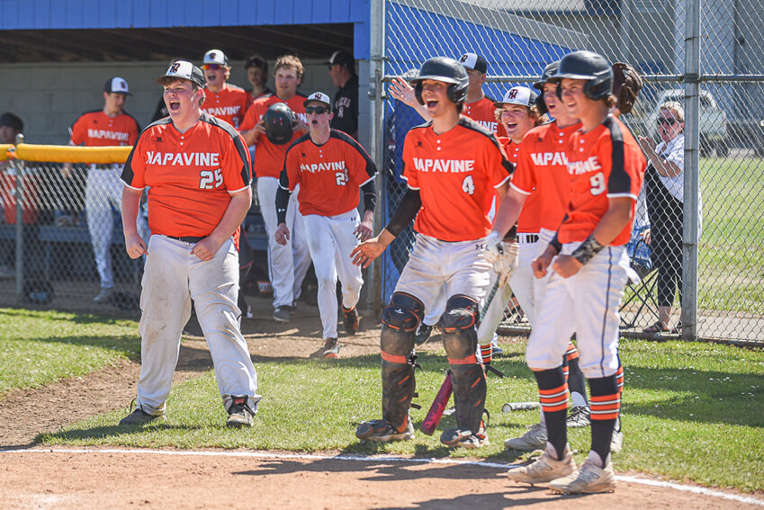 The Tigers celebrate as Conner Holmes races home to complete a little league home run during Napavine's 9-6 win over Ilwaco in the District 4 third-place game at Adna on May 10.