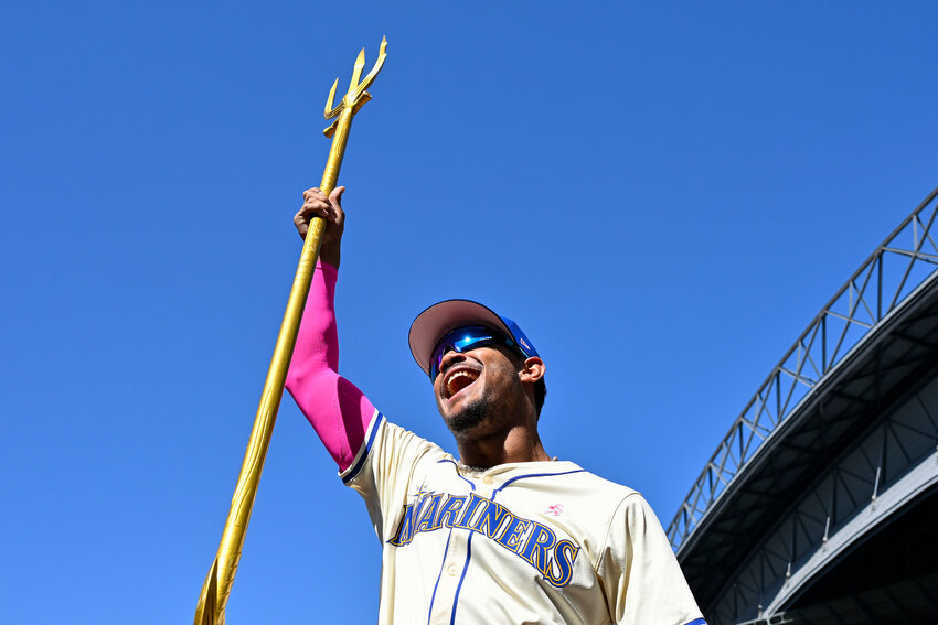 Julio Rodriguez #44 of the Seattle Mariners holds up the team trident after the game against the Oakland Athletics at T-Mobile Park on May 12, 2024 in Seattle, Washington. The Seattle Mariners won 8-4.