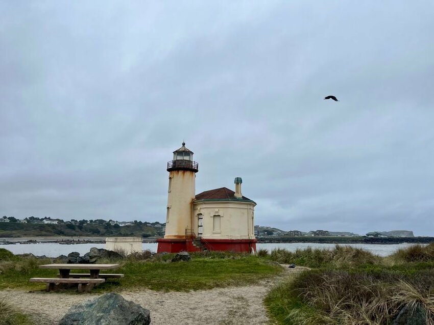 Coquille River Lighthouse sits on a rocky edge of Bullards Beach State Park in Bandon.