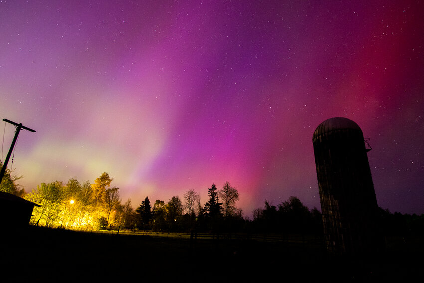 Hues of purple, red and green glow in the skies over Salkum on Friday, May 10, as the Northern Lights were visible during a powerful geomagnetic storm.