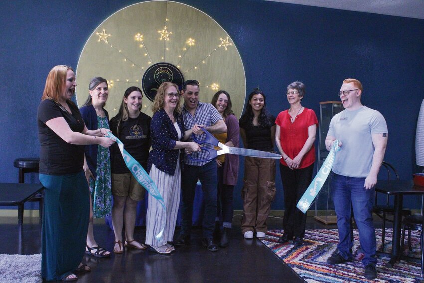 Andrea Levanti and Diego Fleitas, surrounded by members of the InGenius! community, cut the ribbon marking the grand opening of InGenius! Artventures on May 11.