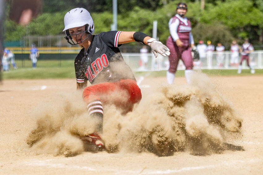 Toledo's Quyn Norberg slides into home base to win the game, 1-0, against Ocosta at Fort Borst Park on Wednesday, May 15.