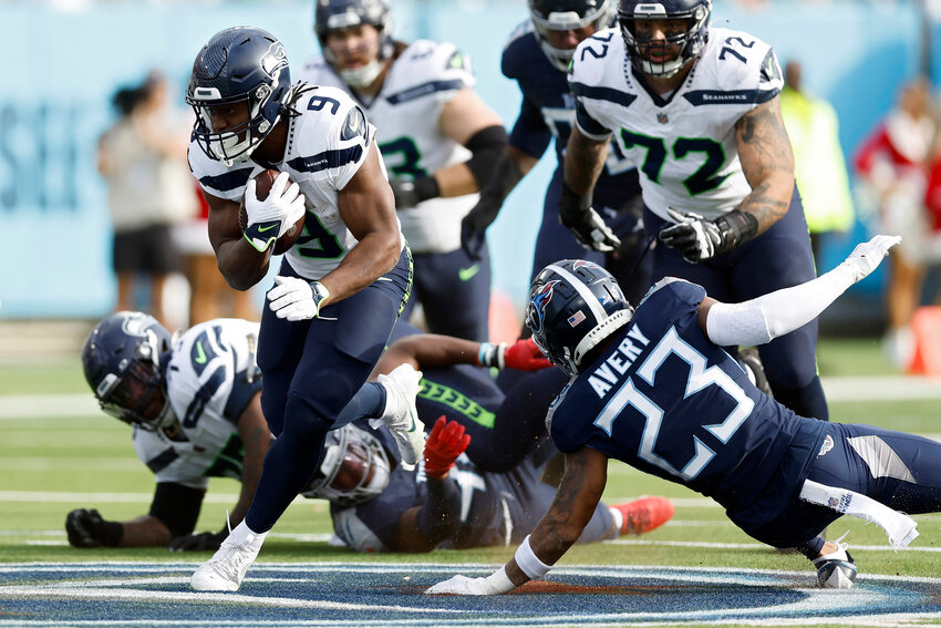 Kenneth Walker III #9 of the Seattle Seahawks runs the ball during the second half in the game against the Tennessee Titans at Nissan Stadium on December 24, 2023 in Nashville, Tennessee. (Photo by Wesley Hitt/Getty Images)