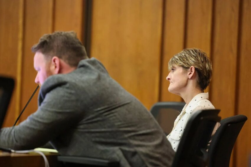 Defense attorney John Terry, left, sits next to his client Heather Annette Hughes during the second day of her trial in Cowlitz County Superior Court on Wednesday, May 15 in Kelso. The next day, a jury found her guilty of seven charges.
