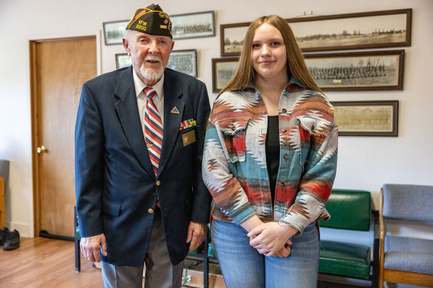 VFW Post 2200 Commander Roger Towers and Emily Hammack, eighth grader at Rochester Middle School, pose for a photo at the American Legion in Centralia on Tuesday, May 14.