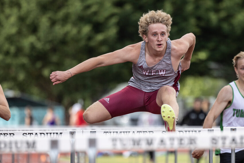 W.F. West&rsquo;s Hayden Niemi leaps over a hurdle during the 2A District 4 championships at Tumwater High School on Friday, May 17.