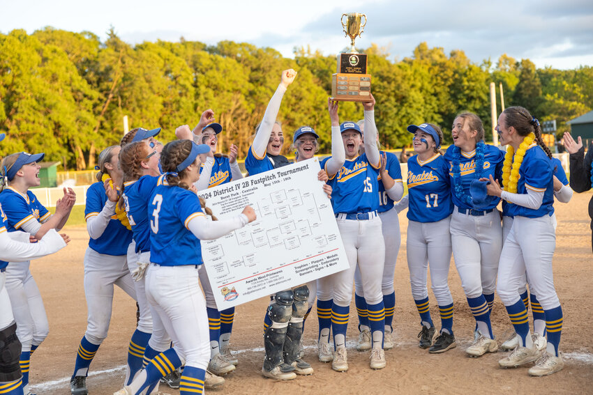 Adna softball players celebrate winning the 2B District 4 championship softball game against Forks at Fort Borst on Saturday, May 18.