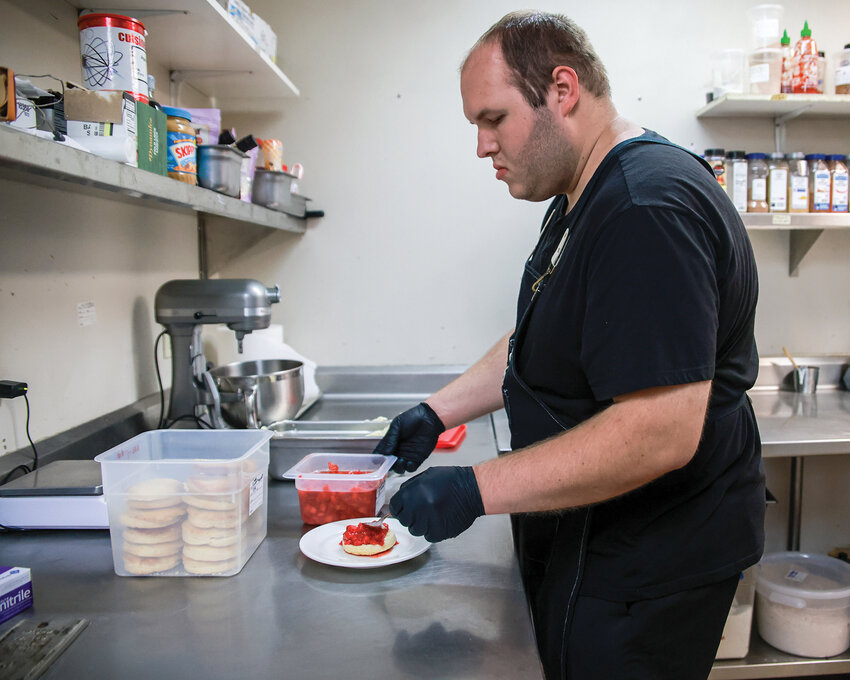 Lewis River Golf Course pastry chef Noah Lefever prepares a strawberry shortcake in the golf course’s kitchen, Thursday, May 16. Lefever has come a long way since battling a brain tumor his freshman year at Woodland High School in 2015.