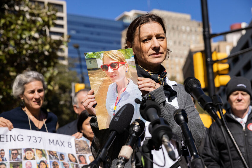 Catherine Berthet holds a photo of her daughter, Camille Geoffroy, after she and other relatives of those killed in two Boeing 737 Max crashes spoke at a federal court arraignment Thursday in Fort Worth.