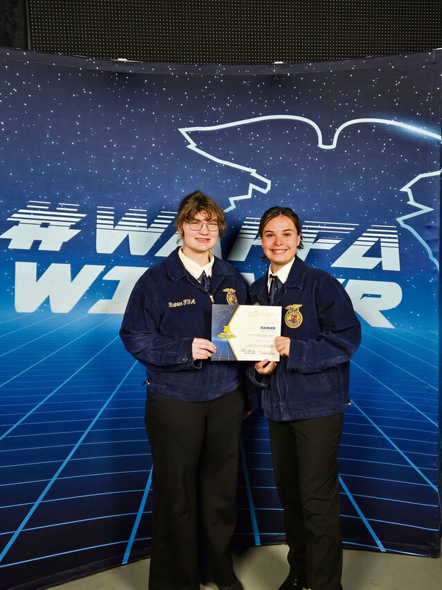 Hailey Roberts and Lilly Johnson of Rainier FFA pose for a photo after winning the Superior Chapter award at the Washington FFA Convention in Pullman on May 11.