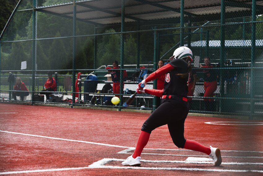 Junior Tornados catcher Layah Hicks squares up with the ball while swinging her bat against Silas High School on May 16.