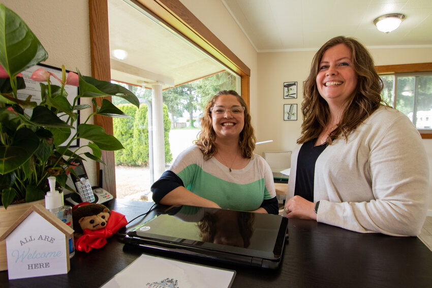 Jystine Gross, left, and Sabrina Hoffman, the owners of the new Petite Ville Salon and Barber in Centralia, smile for a photo inside their new business on Friday, May 17.
