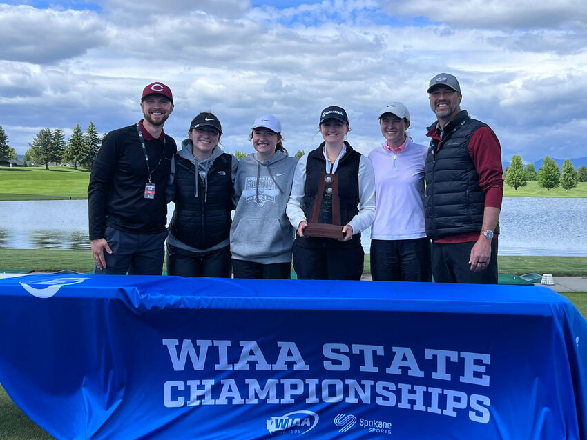 From left to right, W.F. West assistant coach Josh Hergert, Madyson Alexander, Abby Alexander, Natalie Eklund, Grace Oien, and coach Matt Klovdahl pose for a photo with the third-place trophy after placing third at the 2A Girls State Golf Tournament in Liberty Lake on May 22.