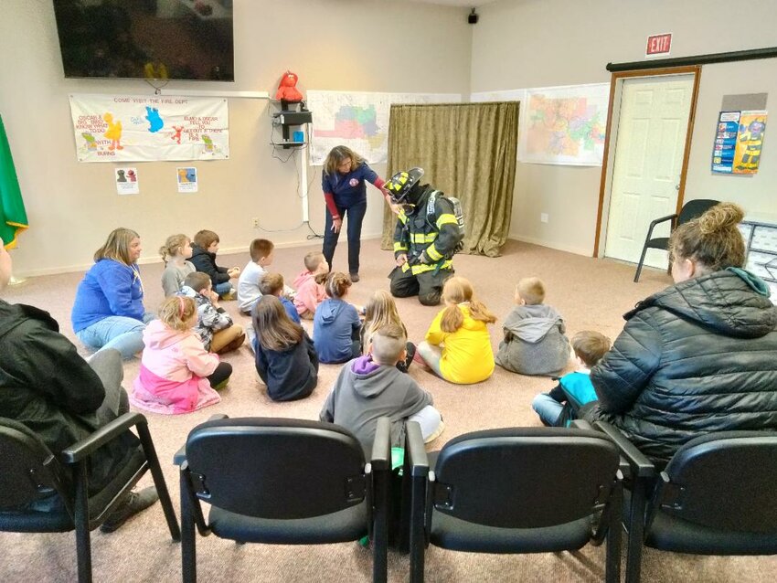 Napavine Elementary School students tour Lewis County Fire District 5 in Napavine on Wednesday, May 23. The students were taught how to &quot;Stop, Drop, and Roll&quot; and viewed the station's firefighting equipment.