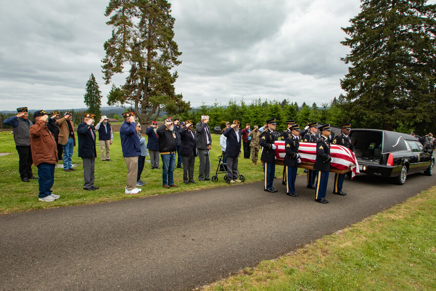 U.S. Army Honor Guard pallbearers carry Sergeant George Frank Bishop of Centralia to his final resting place at Claquato Cemetery in Chehalis on Thursday, May 23, after his remains were finally identified some 80 years after he died in a Japanese prisoner of war camp in the Philippines in 1942.
