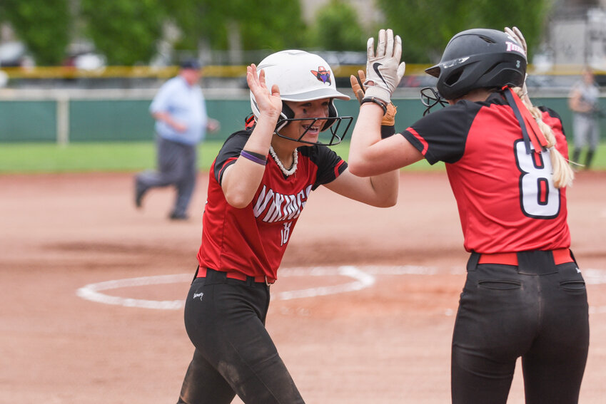 Mossyrock&rsquo;s Hadleigh Gerard high fives Brooke Schwartz during 1B softball quarterfinals at Gateway Sports Complex in Yakima on Friday, May 24.