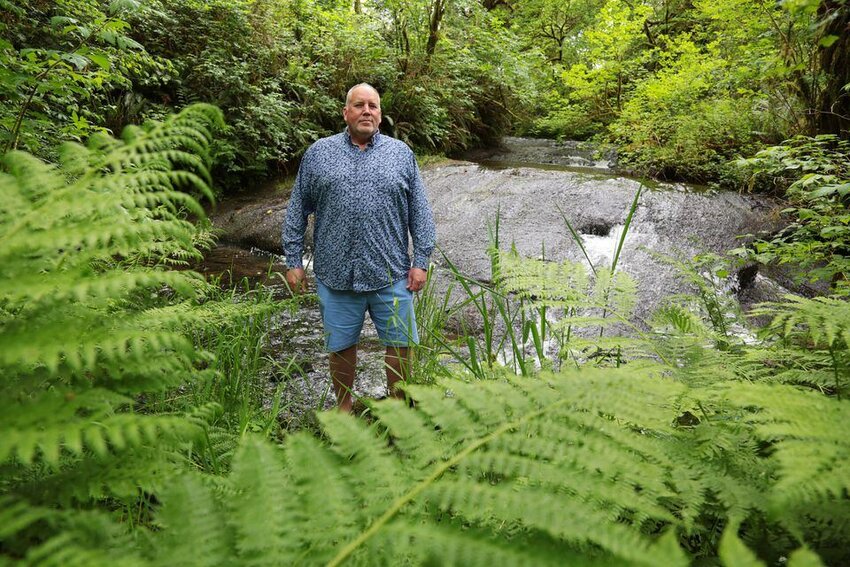 Robert Kentta, tribal council member for the Confederated Tribes of Siletz Indians, stands on former reservation land that once belonged to his great-grandfather, who was removed from southwest Oregon in 1856.