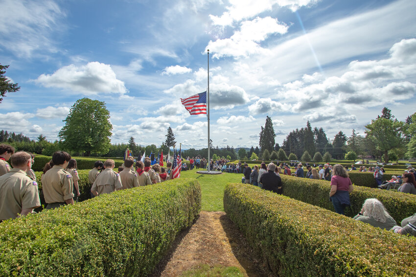 The American flag flies at half mast during a Memorial Day ceremony at Claquato Cemetery in Chehalis on Monday, May 27.