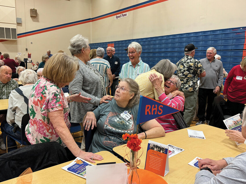 Former Spudder classmates greet one another at the Spudder Golden Grads reunion in the Ridgefield High School gym on Sunday, May 19. Attendees were from the classes of 1947 through 1974.