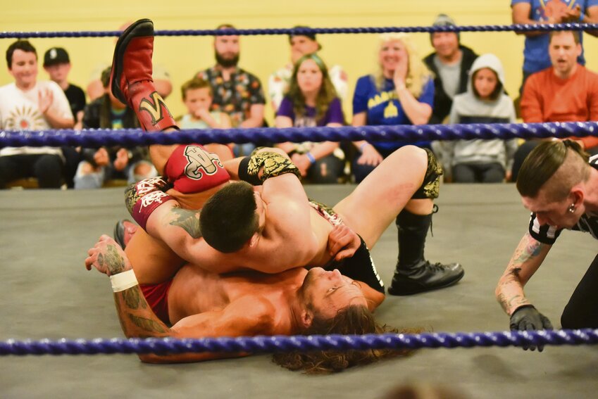 Bryce Saturn attempts to pin his opponent, Chris Masters, during their match on May 25 inside Heritage Hall for Oblivion Wrestling's debut show.