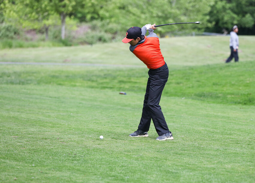 Rainier's Joshua Peralta begins his swing for his tee shot during the second round of the Class 1B/2B state golf championships on May 22 at Tumwater Valley Golf Club.