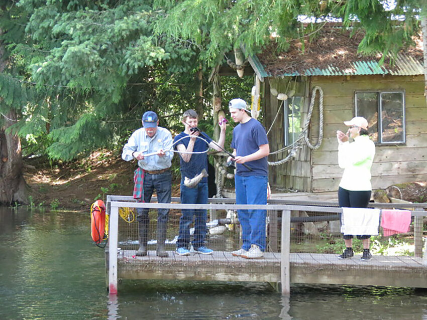 W.F. West students and a volunteer enjoy a day of fishing during an event on Monday, June 11, 2019.