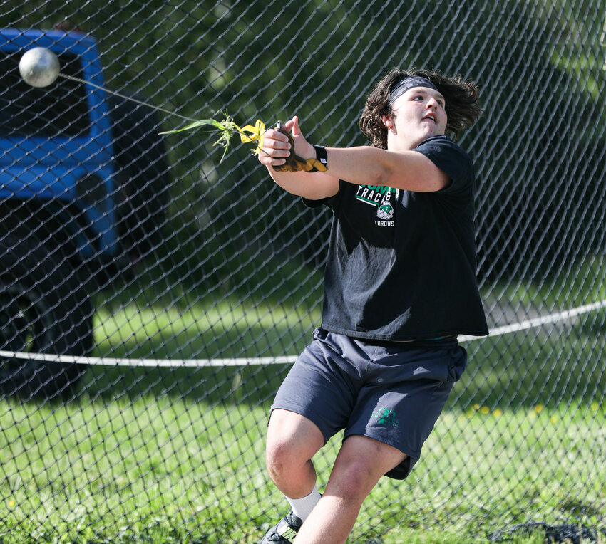 Tumwater's Dylan Gilliland begins his spinning motion in throwing the hammer throw in Tumwater. Gilliland, a junior, won the state hammer throw title last weekend.
