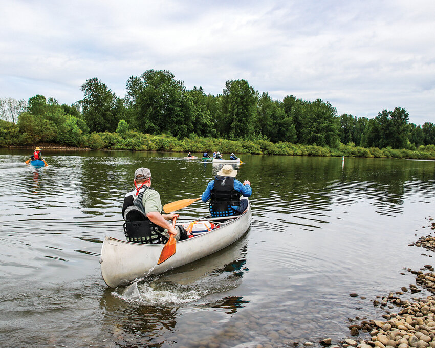 A group opted to vote if they should continue their paddle journey further downriver to before committing to an added trip up the Lewis River, beyond the designated route for the 13th Ridgefield Big Paddle event on Saturday, June 1.